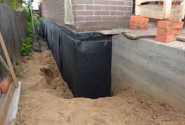 SJ Waterproofing Pros technician performing targeted Waterproofing assessment in Mitchells, VA